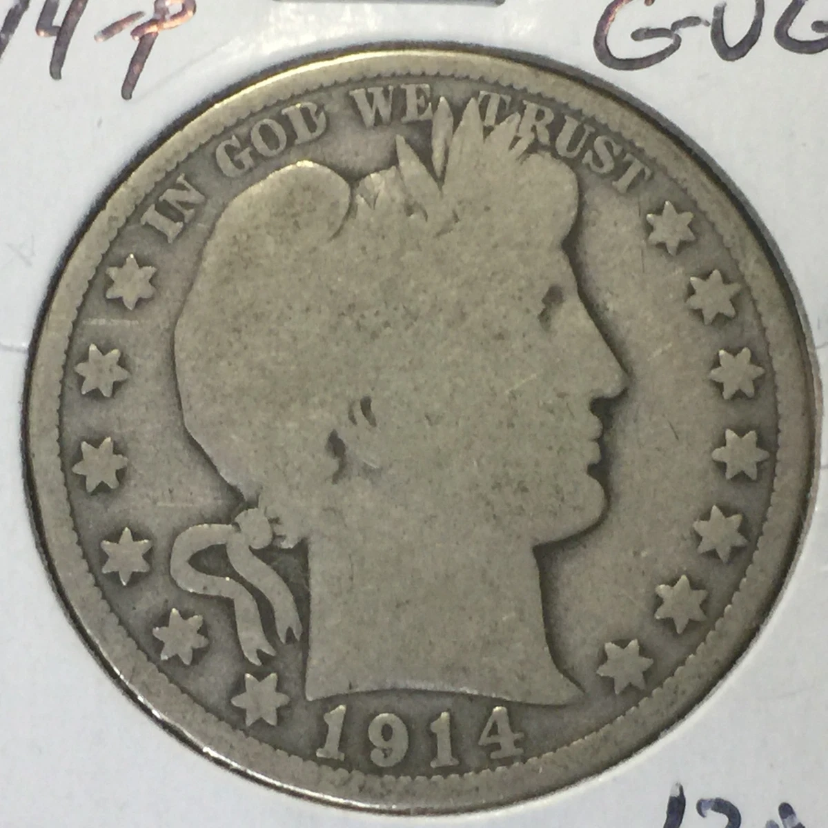 1914 Barber Half Dollar lamination error showing a planchet metal flap or separation on the coin surface